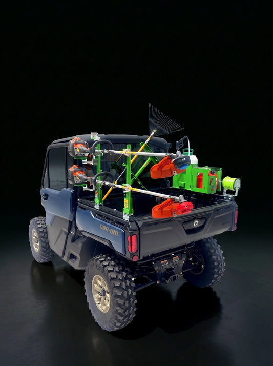 CA100 bed rail system with racks and trimmers mounted on a 2026 Can-Am Defender HD11, rear view