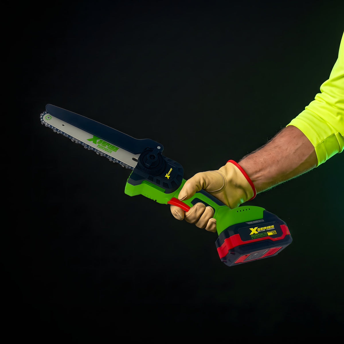 Piranha Series XSAW 20V Cordless Mini Chainsaw held one-handed in a gloved hand | X Series Chainsaw (XSAW100) - TrailerRacks.com